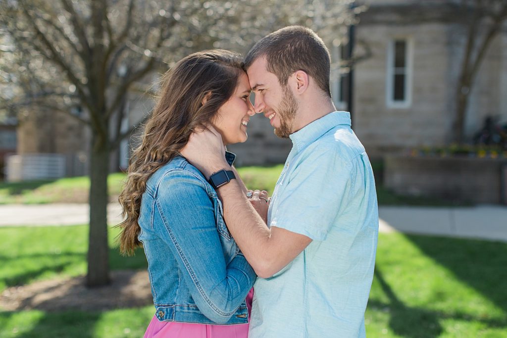 Couple on the quad at Illinois State about to kiss. 
