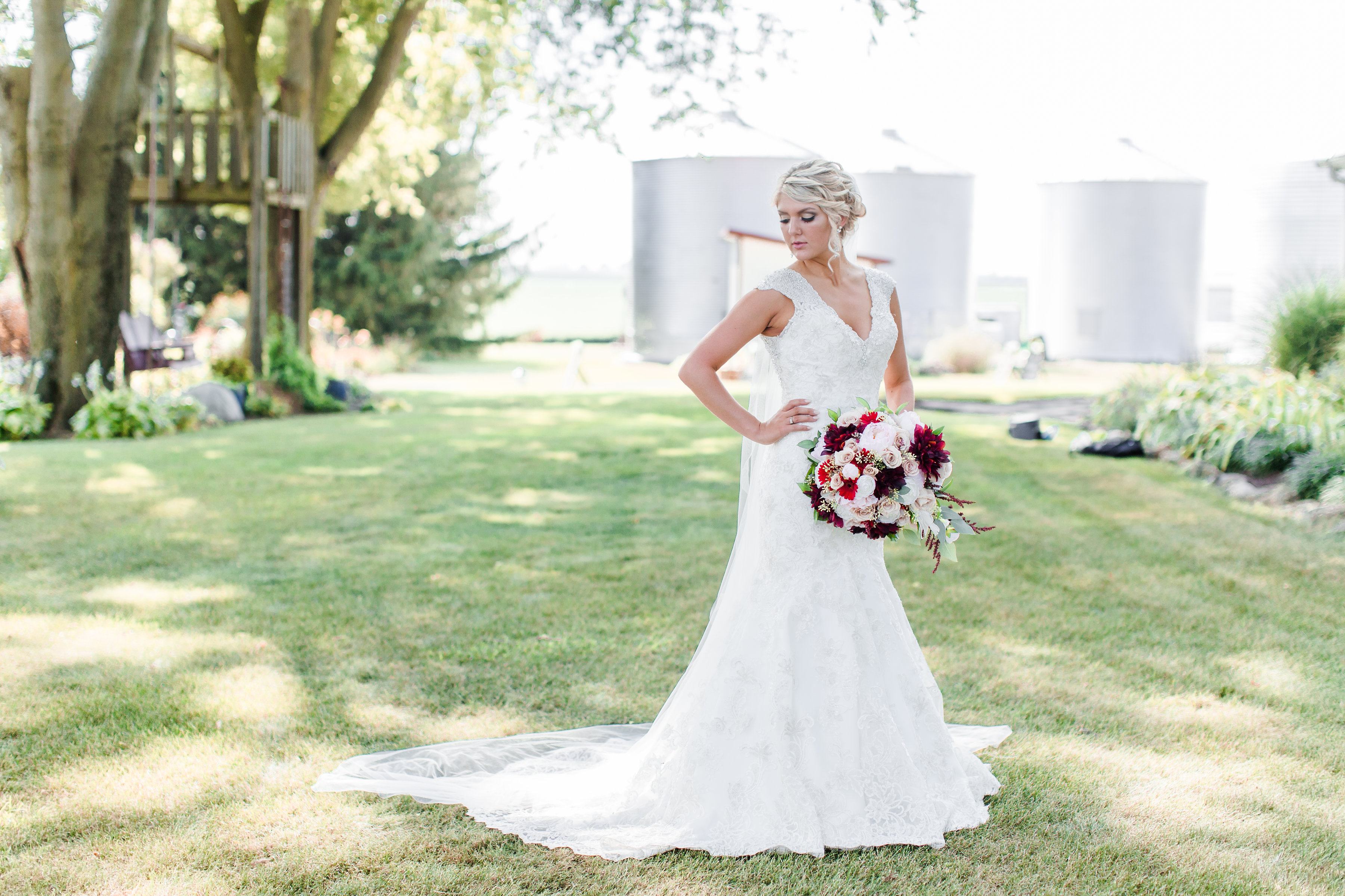 Bride posing with her wedding bouquet at Hudson Farm in Urbana, IL