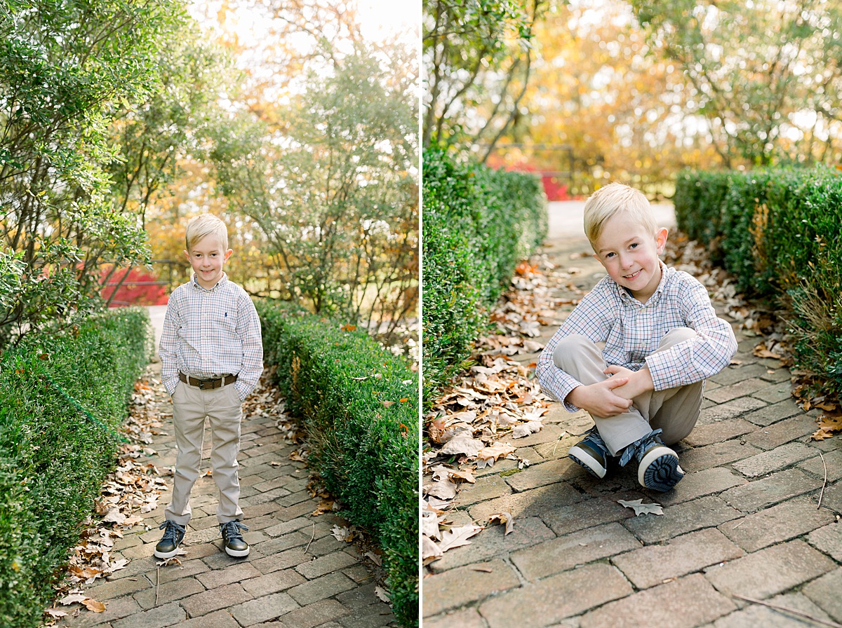 Little boy posing for his picture in the fall at Coxhall gardens with a family photographer. 